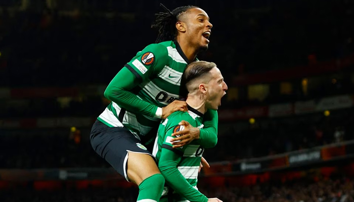 Sporting CPs Nuno Santos celebrates with Youssef Chermiti after scoring the winning penalty in the shootout. — Reuters/File