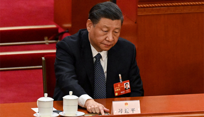 Chinas President Xi Jinping votes during the fifth plenary session of the National Peoples Congress (NPC) at the Great Hall of the People in Beijing. — AFP/File