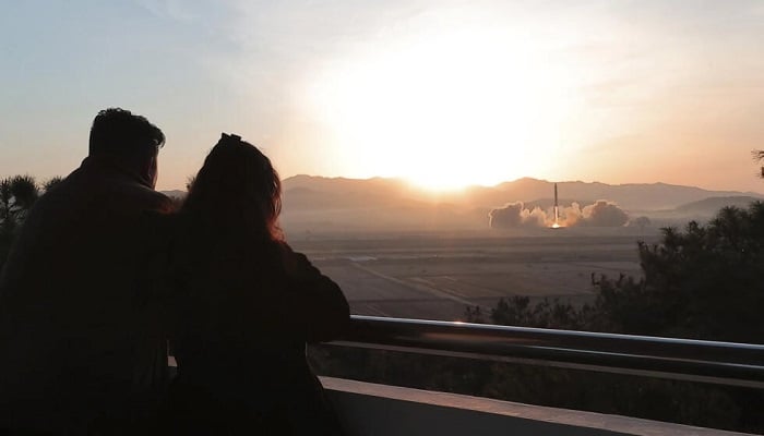 North Korean leader Kim Jong Un (L), accompanied by his daughter, personally oversaw the recent test-firing of the countrys most powerful intercontinental ballistic missile. —AFP