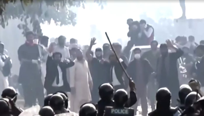 PTI workers clash with police at the Islamabad Judicial Complex, on March 18, 2023, in this still taken from a video. — Reuters
