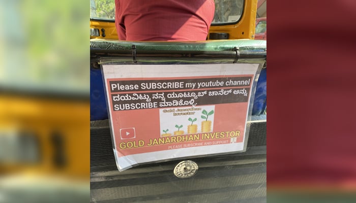 An auto driver in Indias tech capital Bengaluru urging his passengers to subscribe to his YouTube channel through a poster placed in his auto. — Twitter/sushantkoshy