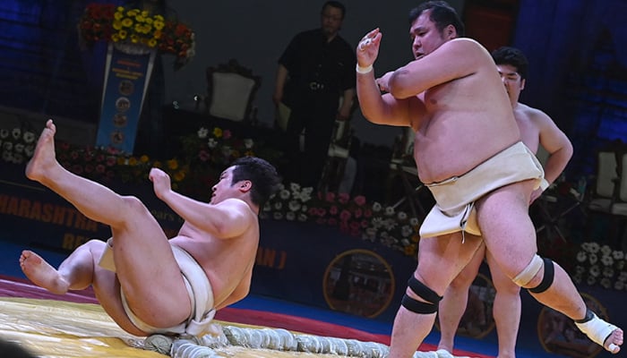 JSumo wrestlers take part in a demonstration fight in front of the Gateway of India in Mumbai on February 3, 2023. — AFP