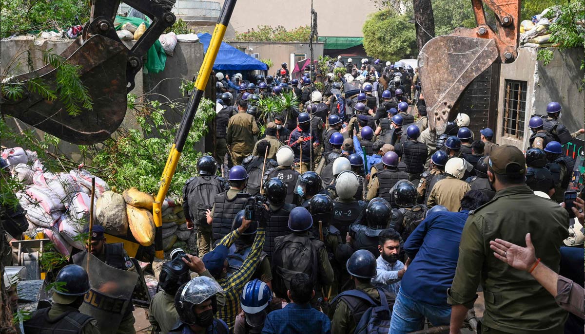 Riot police enter former Prime Minister Imran Khan's residence in Lahore on March 18, 2023.  - AFP