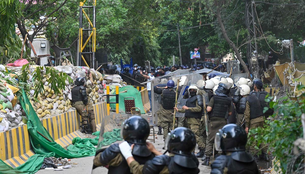 Riot police arrive to raid Imran Khans residence in Lahore after Khan left for Islamabad to appear in a court on March 18, 2023. — AFP