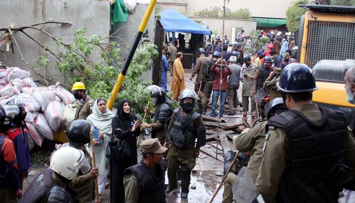 A heavy contingent of the police deployed in Zaman Park for the search and cleanup operation at PTI Chairman Imran Khans residence in Lahore on Saturday, March 18, 2023. — PPI