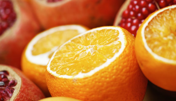 Oranges and pomegranate can be seen in this picture, which is rich sources of Vitamin C. — Unsplash/File