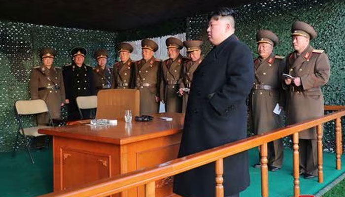 North Korean leader Kim Jong Un watches fire assault drill, at an undisclosed location in North Korea March 10, 2023.—Reuters