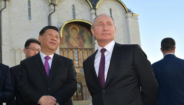 Russian President Vladimir Putin and his Chinese counterpart Xi Jinping tour the Kremlin after their talks in Moscow, Russia. — Reuters/File