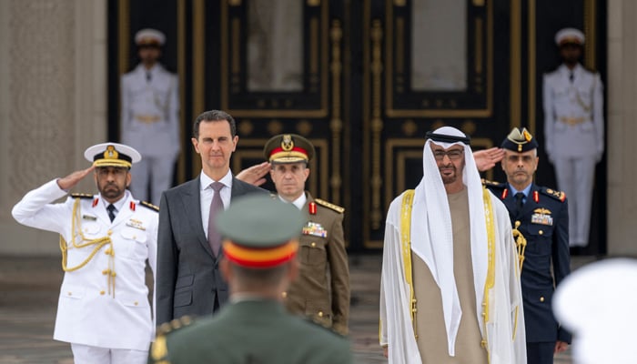 This Image shows Emirati President Sheikh Mohamed bin Zayed al-Nahyan (R) welcoming his Syrian counterpart Bashar al-Assad in Abu Dhabi on March 19, 2023. — AFP