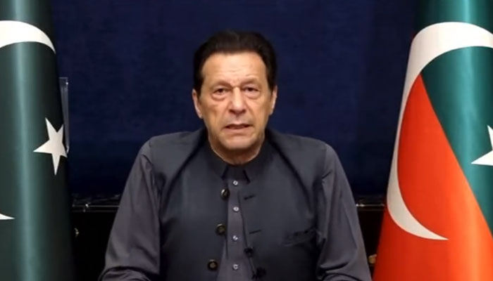 Pakistan Tehreek-e-Insaf Chairman Imran Khan addresses his workers and supporters via video link on March 20, in this still taken from a video. Twitter/PTIofficial