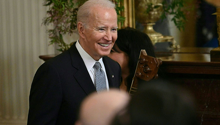 US President Joe Biden arrives for a Nowruz reception in the East Room of the White House in Washington, DC, on March 20, 2023. AFP