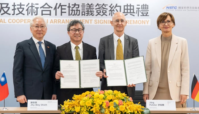 This handout picture taken and released by Taiwans National Science and Technology Council (NSTC) on March 21, 2023, shows German Minister of Education and Research Bettina Stark-Watzinger (R) posing for photographs with her Taiwanese counterpart Wu Tsung-tsong (L), Minister of Science and Technology, during a signing ceremony at the NSTC in Taipei. — AFP