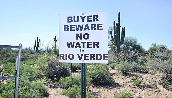 In this file photo taken on February 24, 2023 a sign warns home and property buyers about the water situation in Rio Verde, an unincorporated community in Maricopa County, outside of Scottsdale, Arizona. AFP