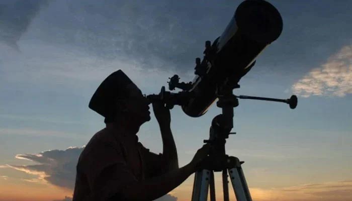 An undated image of a person sighting the moon. — AFP