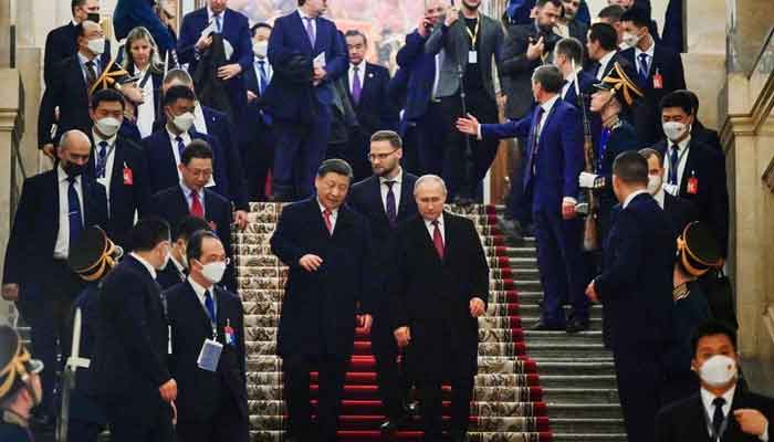 Russian President Vladimir Putin and Chinese President Xi Jinping leave after a reception in honor of the Chinese leaders visit to Moscow, at the Kremlin in Moscow, Russia March 21, 2023. — Reuters