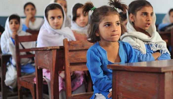 The picture shows students sitting in a class room. — AFP/File