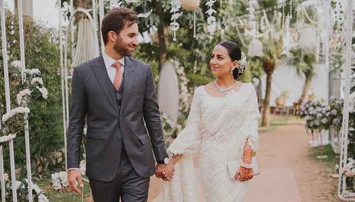 Pakistani actress Ushna Shah (right) and her husband, Hamza Amin, can be seen holding hands. — Instagram/ushnashah