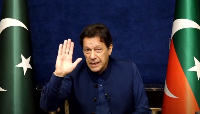 PTI Chairman Imran Khan addresses workers and supporters via video in from Lahore, on March 22, 2023, in this still taken from a video. — YouTube/PTI