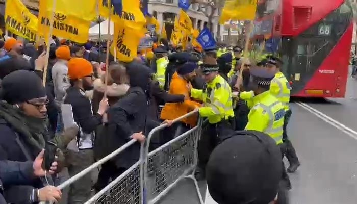 Police try to keep Khalistan protesters behind barricades. — photo by author