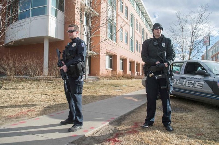 Police officers stand guard outside the Rocky Mountain Regional Trauma Center after a shooting at a motorcycle show at the National Western Complex in Denver, Colorado January 30, 2016. REUTERS/Evan Semon