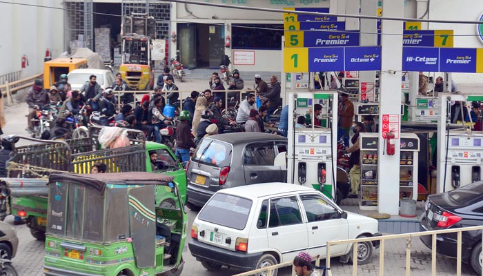 A view of Motorists standing in a queue for filling petrol outside a petrol pump in Rawalpindi on January 1, 2023. — Online