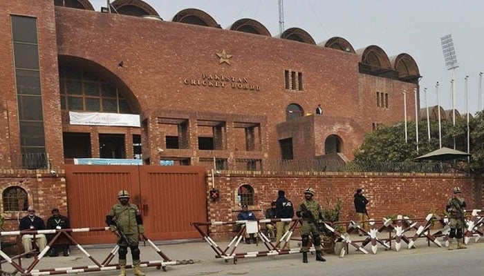 Security personnel stand outside the PCB headquarters in Lahore. — AFP/File