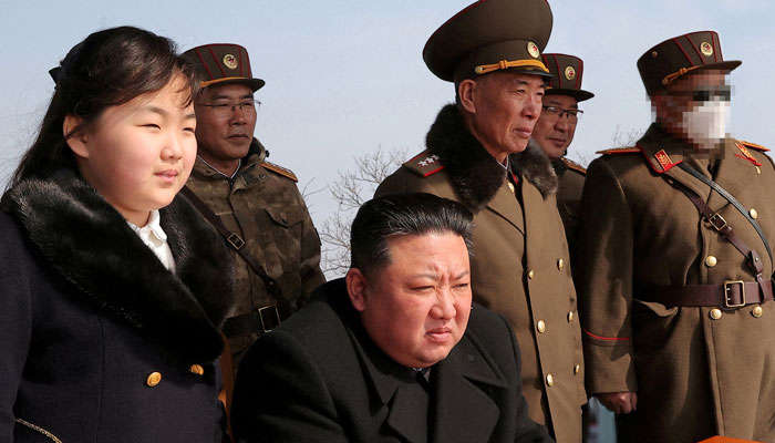 North Korean leader Kim Jong Un and his daughter Kim Ju Ae watch a missile drill at an undisclosed location in this image released by North Koreas Central News Agency (KCNA) on March 20, 2023. — KCNA via REUTERS