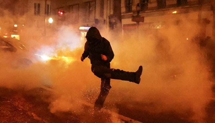A protester clashes with riot police during a demonstration on the ninth day of nationwide protests against the French governments pension reform, Paris, France, March 23, 2023. — Reuters