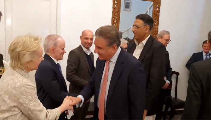 Pakistan Tehreek-e-Insaf leaders Shah Mahmood Qureshi and Asad Umar meet with the European Union envoys at the Austrian ambassador’s residence on Friday. —PTI video/screengrab