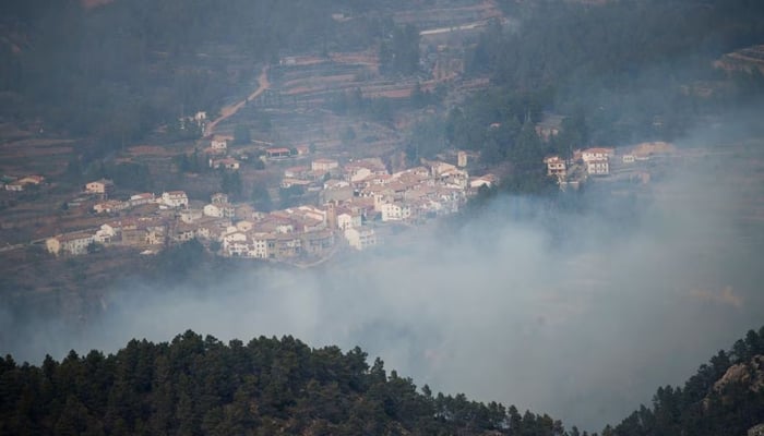 Smoke rises during a wildfire in Los Calpes, Spain, March 24, 2023. — Reuters