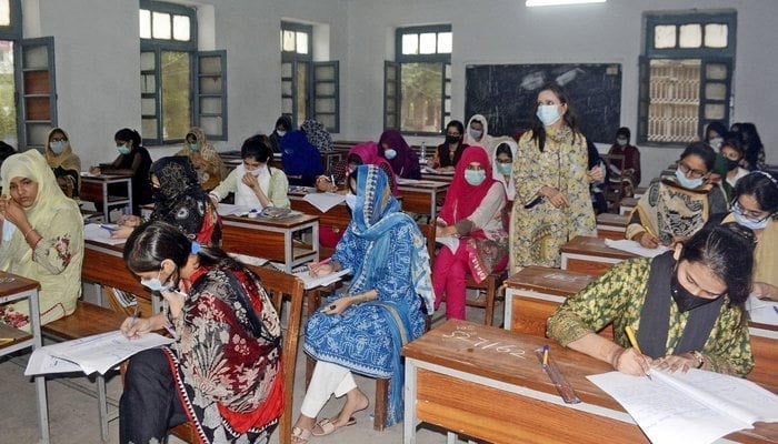 Students take an exam at an examination centre in Karachi. — ONLINE?File