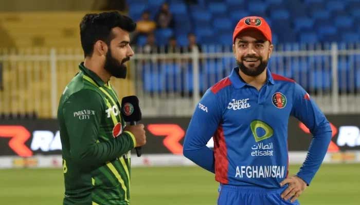 Shadab Khan (left) speaks on the mic after toss in the first T201 against Afghanistan on March 24, 2023. — ACB
