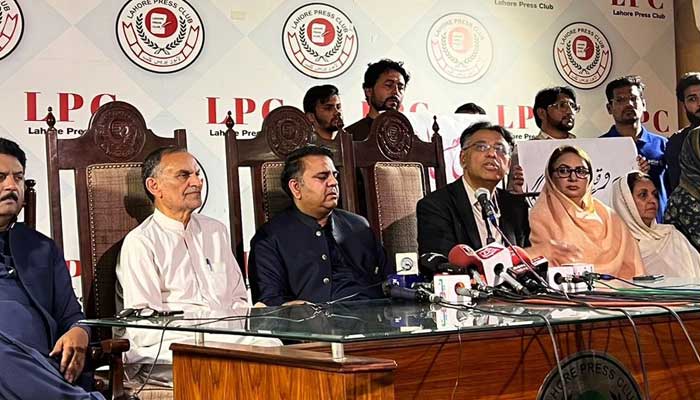 PTI Senior Vice-President Fawad Chaudhry (3rd left) and Secretary General Asad Umar (3rd right) speak during the presser at Lahore Press Club on March 26, 2023. — Twitter/@PTIofficial
