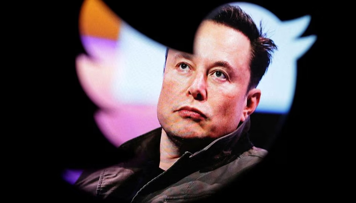 Elon Musks photo is seen through a Twitter logo in this illustration. — Reuters/File