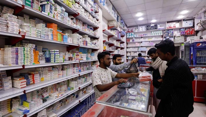 Customers buy medicine from a medical supply store in Karachi, Pakistan February 9, 2023. — Reuters