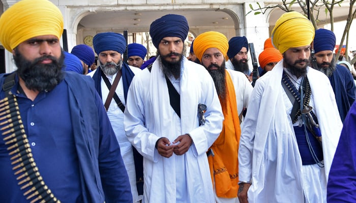 Amritpal Singh, a Sikh leader, leaves the holy Sikh shrine of the Golden Temple along with his supporters, in Amritsar, India, March 3, 2023. — Reuters