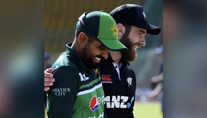 Babar Azam (left) and New Zealand Cricketer Kane Williamson sharing a light moment on January 13, 2023. — AFP