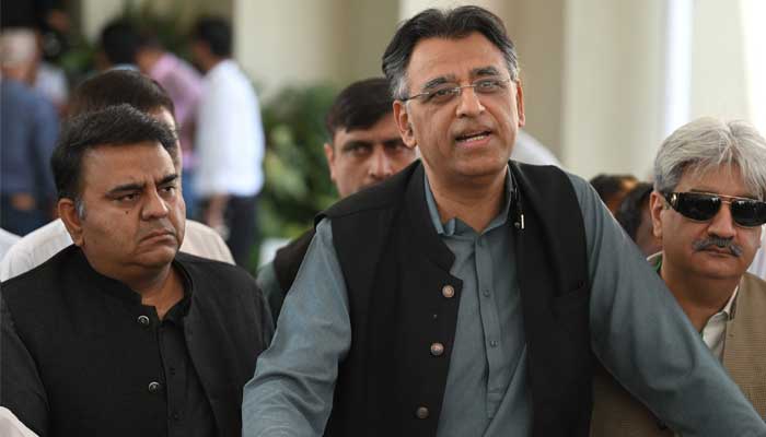 PTI leader Asad Umar speaks with the media outside the Supreme Court building prior to start of a hearing, in Islamabad on April 6, 2022. — AFP