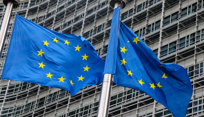 European Union flags fly outside the headquarters of the European Commission in Brussels. AFP/File