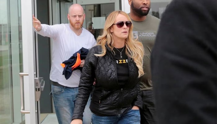 Adult film star Stormy Daniels, whose real name is Stephanie Clifford, and her security leave the Detroit Police Department 4th Precinct after picking up her temporary Dance Permit licence to perform at a club in Detroit, Michigan, US. — Reuters