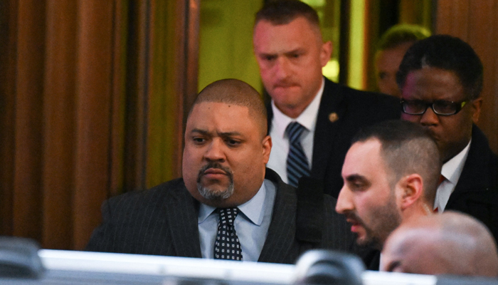 Manhattan District Attorney Alvin Bragg (L) leaves his office in New York on March 30, 2023. A New York grand jury has voted to indict former US president Donald Trump over hush money payments made to Stormy Daniels ahead of the 2016 election. — AFP