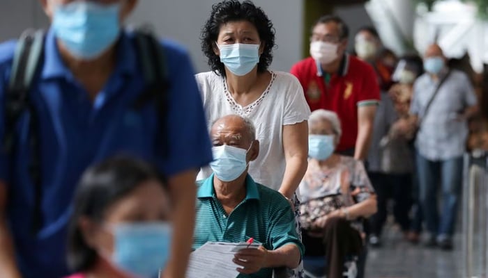 People wait to receive coronavirus disease (COVID-19) vaccines at a vaccination centre in Kuala Lumpur, Malaysia May 31, 2021. — Reuters