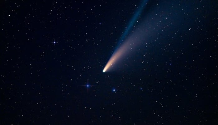 A comet can be seen passing with its tail in this representational illustration. — Unsplash/File