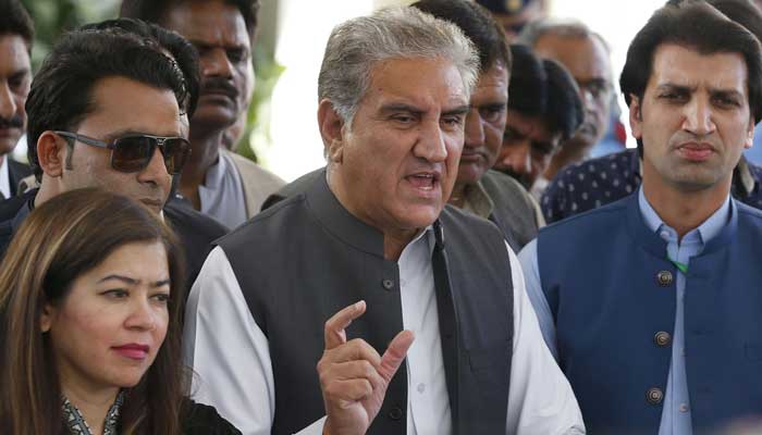 PTI Vice Chairman Shah Mahmood Qureshi talks with journalists after a hearing outside the Supreme Court building in Islamabad on April 7, 2022. — Online