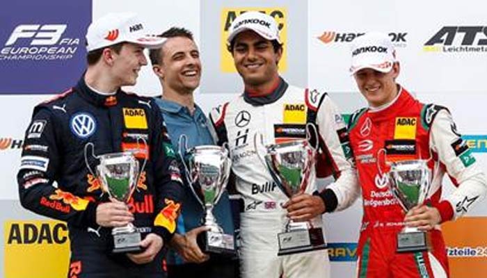 Enaam Ahmed (third from left0 poses with his trophy. — Photo by author