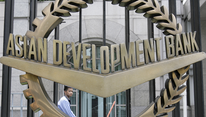 A worker walks past inside the Asian Development Bank (ADB) headquarters in Manila June 17, 2009. — Reuters