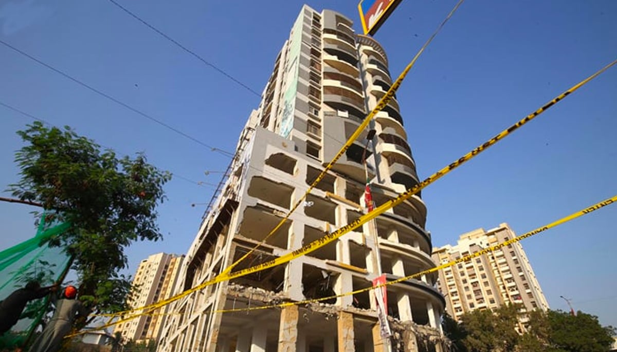 The 15-storey-high Nasla Tower in the process of being demolished. — INP