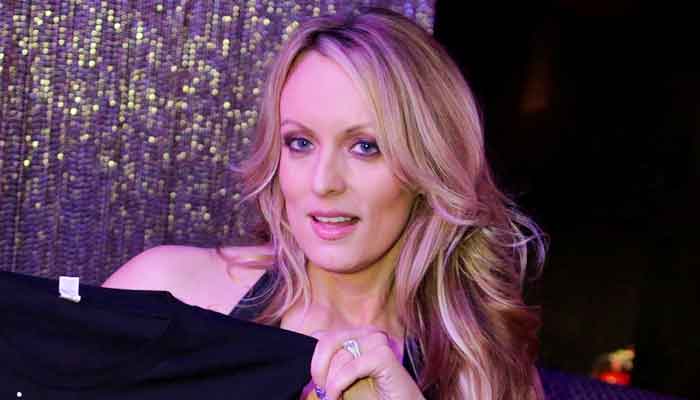 Adult-film actor Stephanie Clifford, also known as Stormy Daniels, poses for pictures at the end of her striptease show in Gossip Gentleman Club in Long Island, New York, U.S., February 23, 2018. Reuters/File