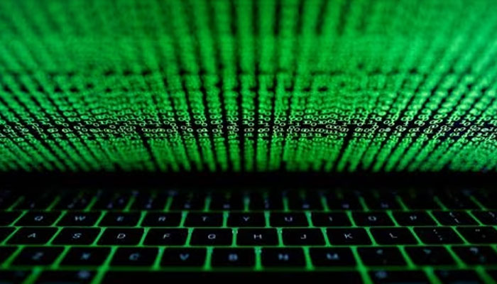 A computer keyboard lit by a displayed cyber code is seen in this illustration picture taken on March 1, 2017. —Reuters