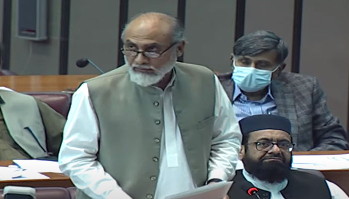 Balcohsitan Awami Party lawmaker Khalid Magsi reads out the resolution in the National Assembly before its approval. — Screengrab/PTV News